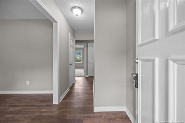 615 Wallingford Ct, Fayetteville, NC 28314 - hallway with dark wood finished floors and a textured ceiling