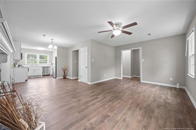 615 Wallingford Ct, Fayetteville, NC 28314 - unfurnished living room featuring a ceiling fan and wood finished floors