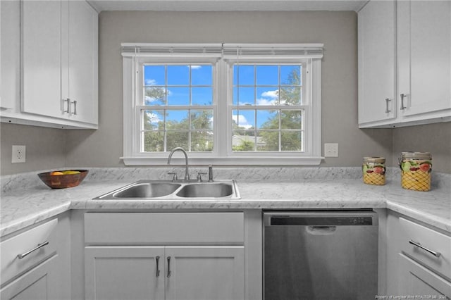 615 Wallingford Ct, Fayetteville, NC 28314 - kitchen with stainless steel dishwasher, light countertops, and white cabinetry