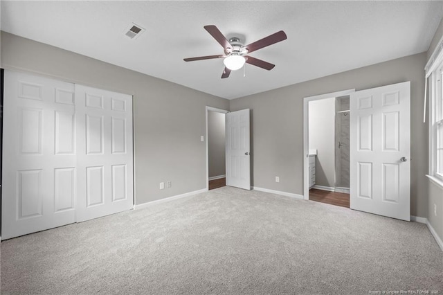615 Wallingford Ct, Fayetteville, NC 28314 - unfurnished bedroom featuring carpet, a closet, ensuite bathroom, and a ceiling fan