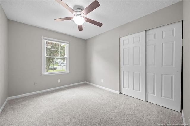 615 Wallingford Ct, Fayetteville, NC 28314 - unfurnished bedroom with carpet floors, a closet, a textured ceiling, and ceiling fan
