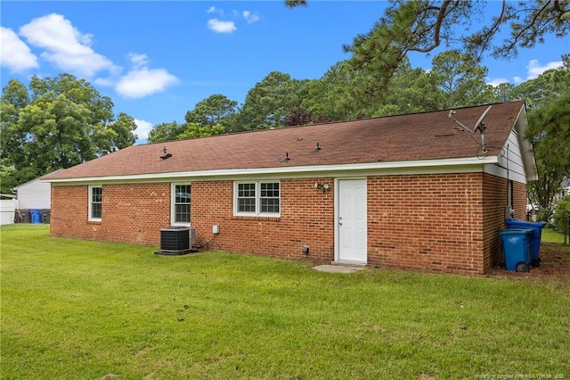 615 Wallingford Ct, Fayetteville, NC 28314 - back of house featuring a lawn and brick siding