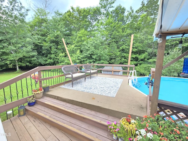 4411 Fairland Ct, Burlington, NC 27215 - deck with an outdoor pool, a lawn, and view of wooded area
