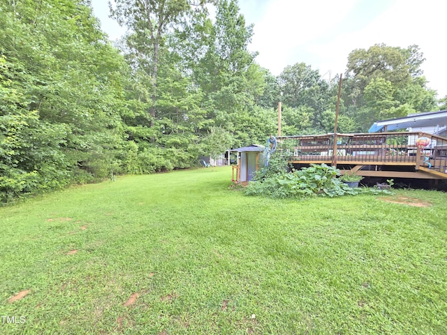 4411 Fairland Ct, Burlington, NC 27215 - view of green lawn with a wooden deck