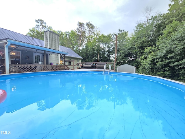 4411 Fairland Ct, Burlington, NC 27215 - outdoor pool with a deck and view of scattered trees