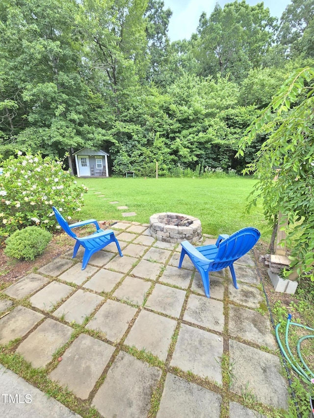 4411 Fairland Ct, Burlington, NC 27215 - view of patio / terrace featuring a fire pit and an outbuilding