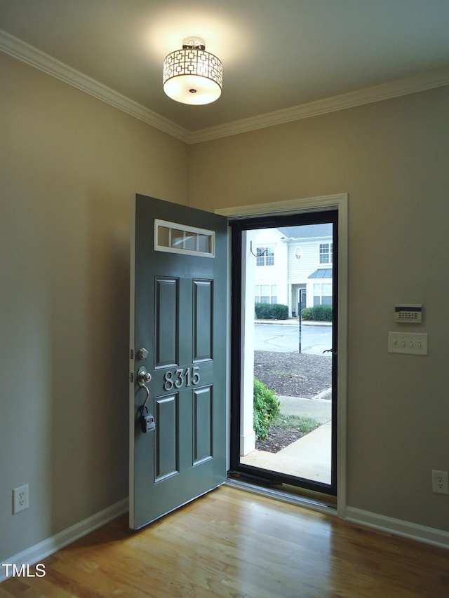 8315 City Loft Ct, Raleigh, NC 27613 - foyer entrance featuring crown molding and wood finished floors