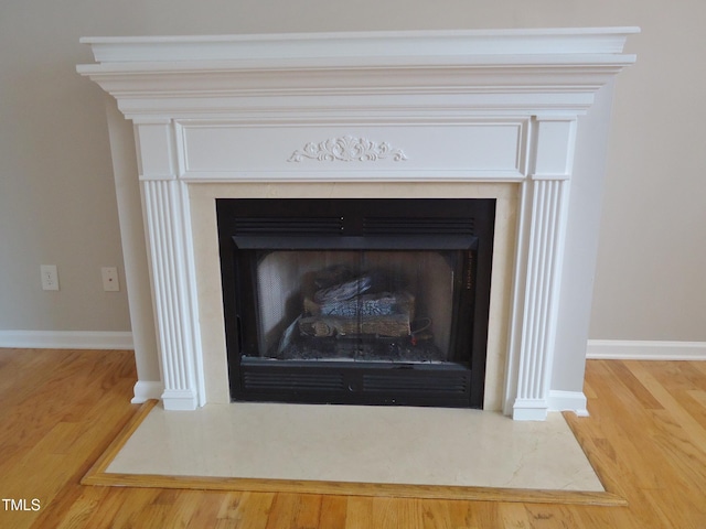8315 City Loft Ct, Raleigh, NC 27613 - detailed view of a fireplace and wood finished floors