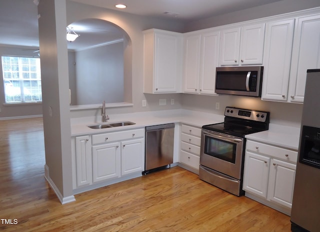 8315 City Loft Ct, Raleigh, NC 27613 - kitchen with appliances with stainless steel finishes, light wood-type flooring, white cabinets, and recessed lighting
