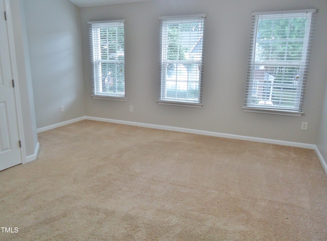 8315 City Loft Ct, Raleigh, NC 27613 - carpeted spare room with baseboards