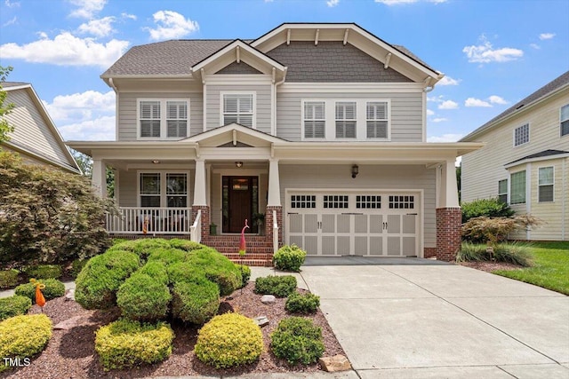 2800 Royal Forrest Dr, Raleigh, NC 27614 - craftsman inspired home with a garage, brick siding, driveway, and covered porch