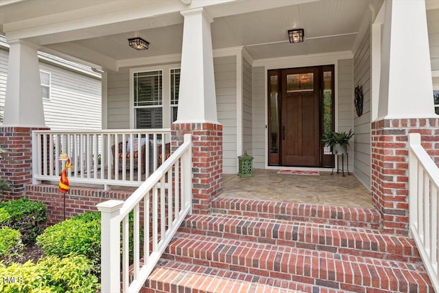 2800 Royal Forrest Dr, Raleigh, NC 27614 - view of exterior entry with covered porch and brick siding