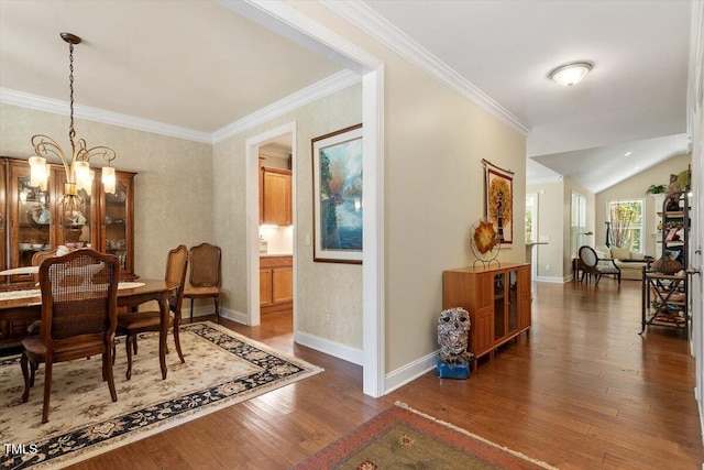 2800 Royal Forrest Dr, Raleigh, NC 27614 - dining space with a chandelier, wood finished floors, ornamental molding, and lofted ceiling