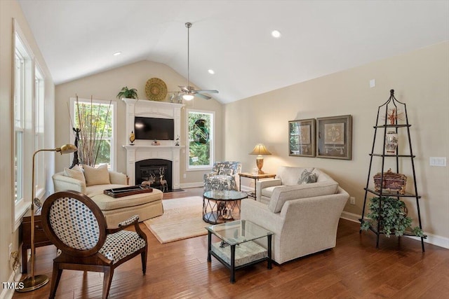 2800 Royal Forrest Dr, Raleigh, NC 27614 - living area with ceiling fan, dark wood-type flooring, healthy amount of natural light, lofted ceiling, and a fireplace with flush hearth
