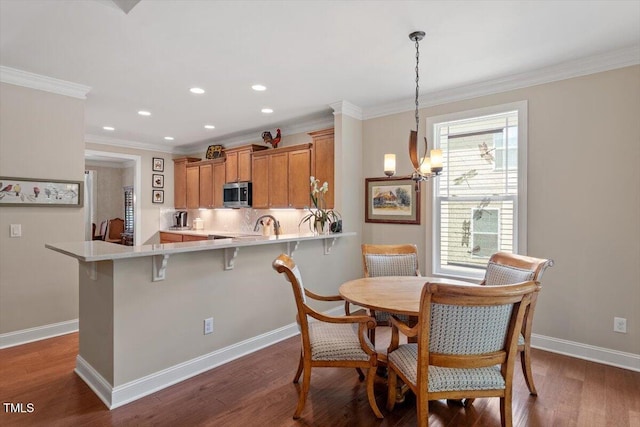 2800 Royal Forrest Dr, Raleigh, NC 27614 - dining room featuring crown molding, dark wood-type flooring, a chandelier, and recessed lighting