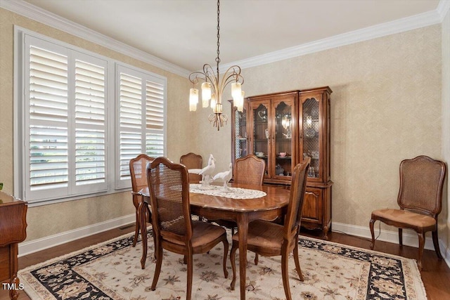 2800 Royal Forrest Dr, Raleigh, NC 27614 - dining room featuring a chandelier, wood finished floors, plenty of natural light, and crown molding