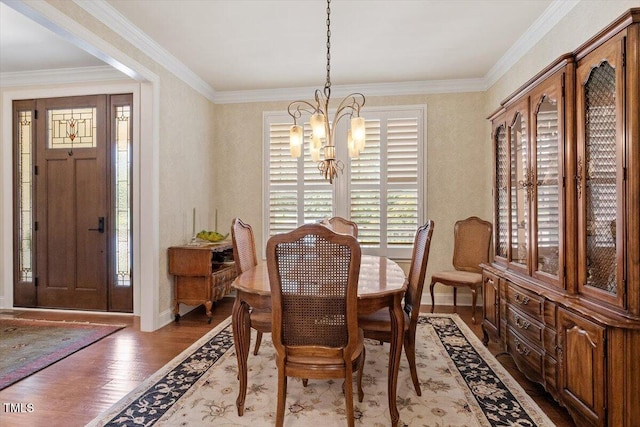 2800 Royal Forrest Dr, Raleigh, NC 27614 - dining room with a chandelier, light wood-style flooring, and ornamental molding