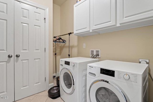 2800 Royal Forrest Dr, Raleigh, NC 27614 - washroom featuring cabinet space, light tile patterned floors, and independent washer and dryer