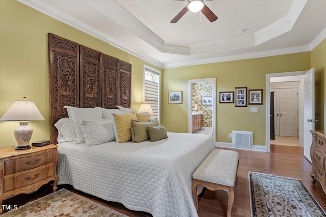 2800 Royal Forrest Dr, Raleigh, NC 27614 - bedroom featuring a tray ceiling, wood finished floors, ornamental molding, and ceiling fan
