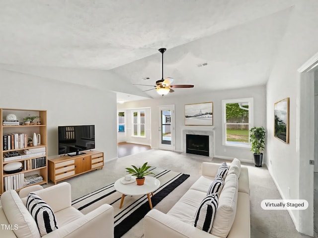 1628 Winnabow Dr, Fayetteville, NC 28304 - living area with lofted ceiling, carpet flooring, ceiling fan, and a high end fireplace