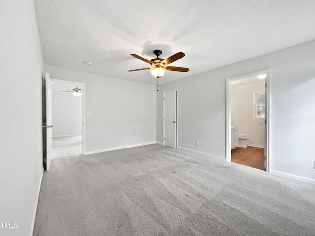 1628 Winnabow Dr, Fayetteville, NC 28304 - unfurnished bedroom with carpet floors, ensuite bath, and ceiling fan