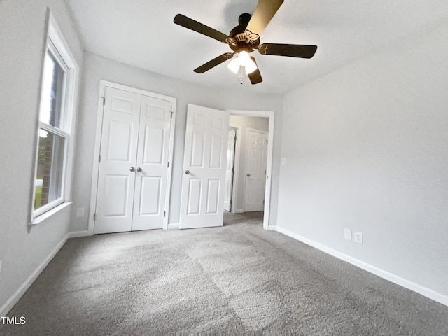 1628 Winnabow Dr, Fayetteville, NC 28304 - unfurnished bedroom with carpet, a closet, and multiple windows