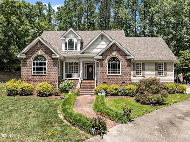 430 Beechwood Trl, Henderson, NC 27536 - view of front of house with brick siding, a porch, and a front lawn