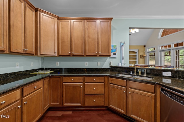 430 Beechwood Trl, Henderson, NC 27536 - kitchen with stainless steel dishwasher, brown cabinetry, dark wood finished floors, dark stone countertops, and vaulted ceiling