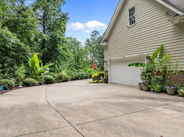 430 Beechwood Trl, Henderson, NC 27536 - view of property exterior featuring driveway and an attached garage