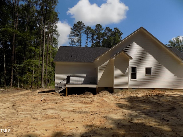 560 S N C 39 Hwy, Louisburg, NC 27549 - view of property exterior featuring crawl space, a wooden deck, and a shingled roof
