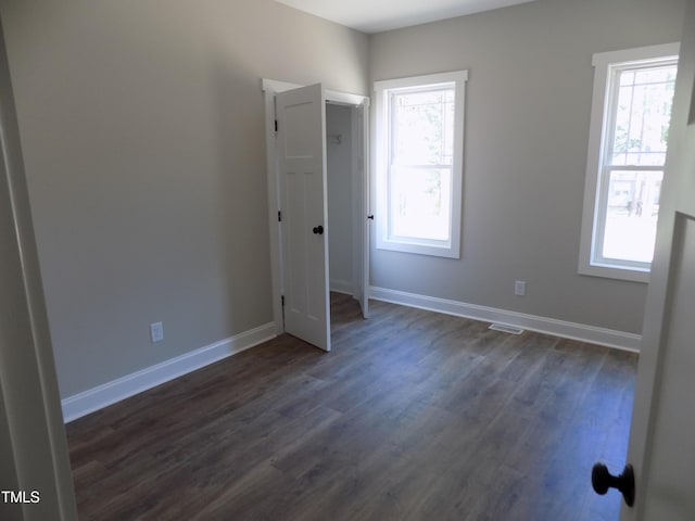 560 S N C 39 Hwy, Louisburg, NC 27549 - spare room featuring dark wood-style floors and baseboards