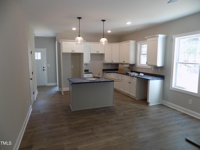 560 S N C 39 Hwy, Louisburg, NC 27549 - kitchen featuring a center island, dark countertops, white cabinets, recessed lighting, and hanging light fixtures