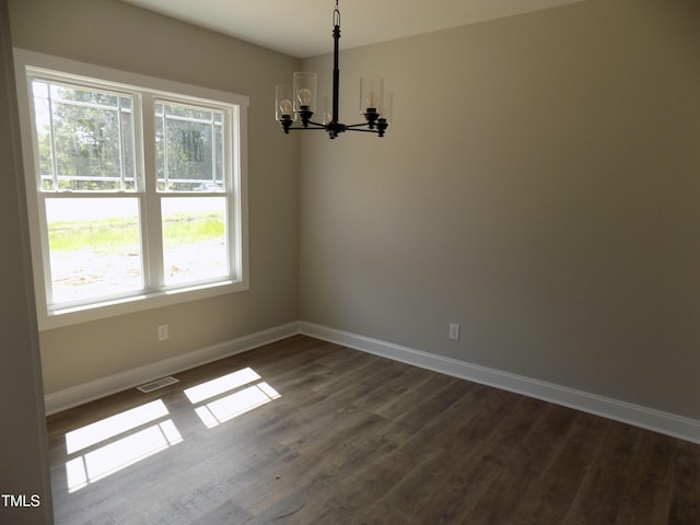 560 S N C 39 Hwy, Louisburg, NC 27549 - unfurnished room with plenty of natural light, a chandelier, and dark wood-style floors