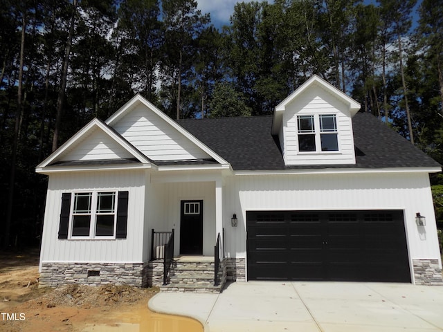 560 S N C 39 Hwy, Louisburg, NC 27549 - view of front of property featuring an attached garage, driveway, a shingled roof, and crawl space