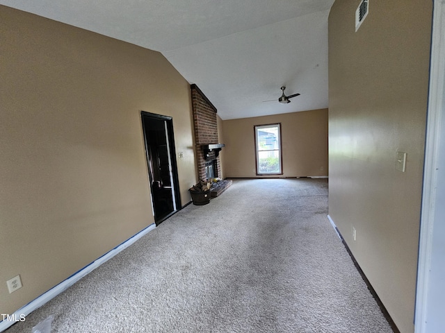 746 Glen Reilly Dr, Fayetteville, NC 28314 - unfurnished living room featuring ceiling fan, carpet floors, a fireplace, and vaulted ceiling