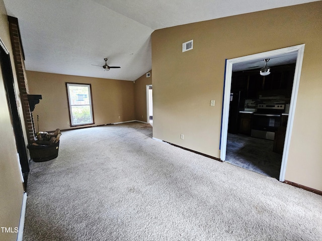 746 Glen Reilly Dr, Fayetteville, NC 28314 - unfurnished living room with ceiling fan, carpet flooring, and vaulted ceiling