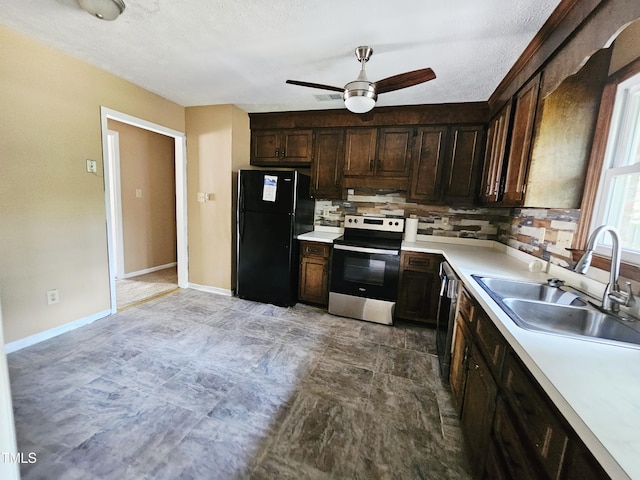 746 Glen Reilly Dr, Fayetteville, NC 28314 - kitchen with stainless steel electric stove, freestanding refrigerator, a ceiling fan, dark brown cabinetry, and light countertops