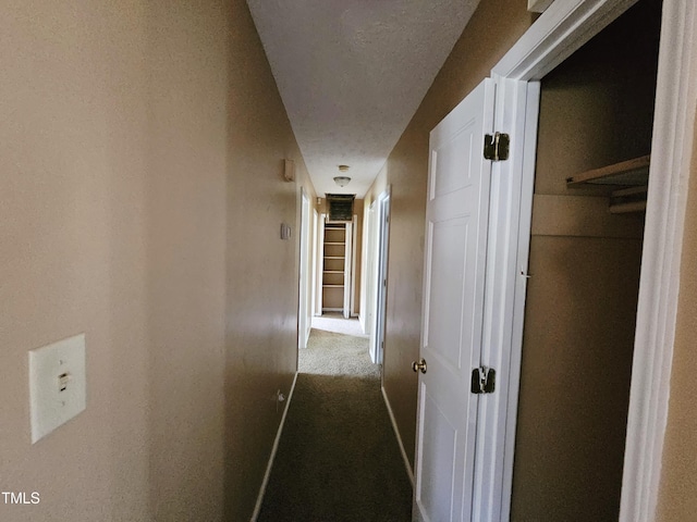 746 Glen Reilly Dr, Fayetteville, NC 28314 - hall featuring dark colored carpet and a textured ceiling