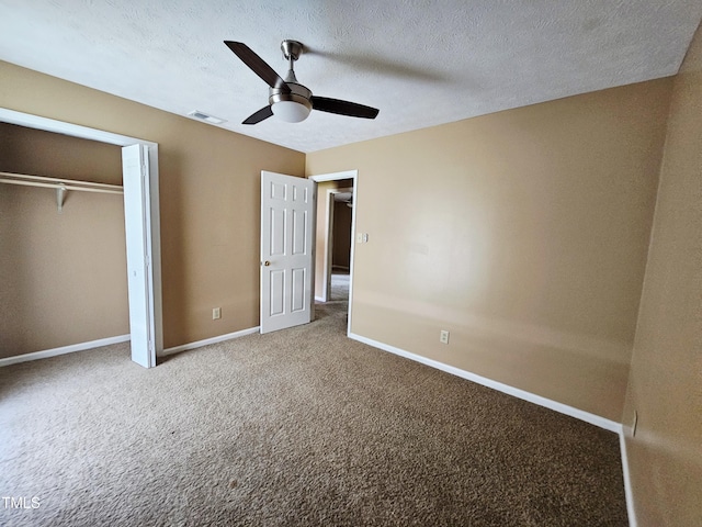 746 Glen Reilly Dr, Fayetteville, NC 28314 - unfurnished bedroom with carpet, a closet, a ceiling fan, and a textured ceiling