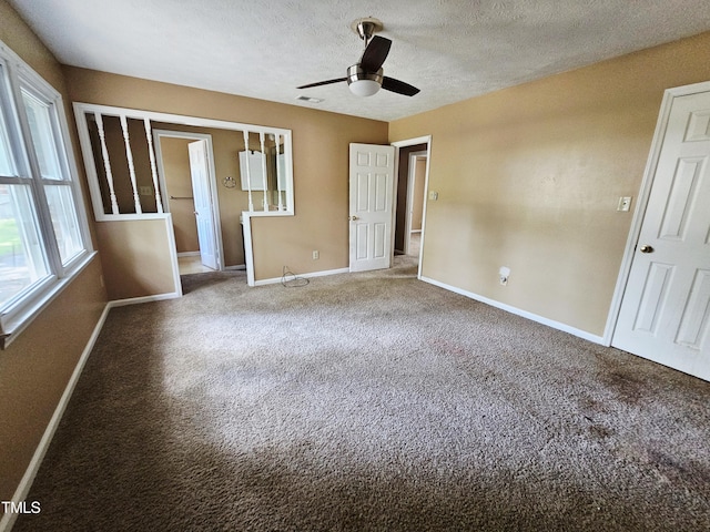 746 Glen Reilly Dr, Fayetteville, NC 28314 - unfurnished bedroom with carpet floors, a textured ceiling, and ceiling fan