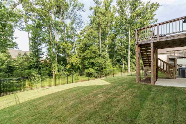111 Court Jester Way, Morrisville, NC 27560 - fenced backyard with stairs, a wooden deck, and a patio area