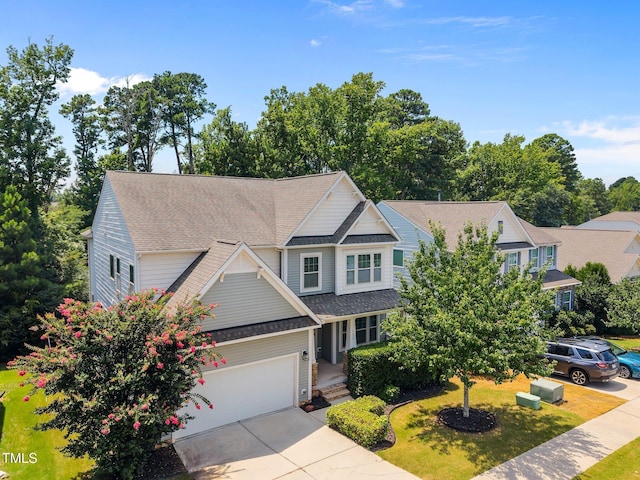 111 Court Jester Way, Morrisville, NC 27560 - view of front of house with driveway, a shingled roof, and a garage