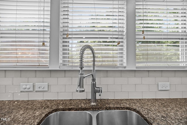 111 Court Jester Way, Morrisville, NC 27560 - kitchen view of tasteful backsplash and dark stone countertops