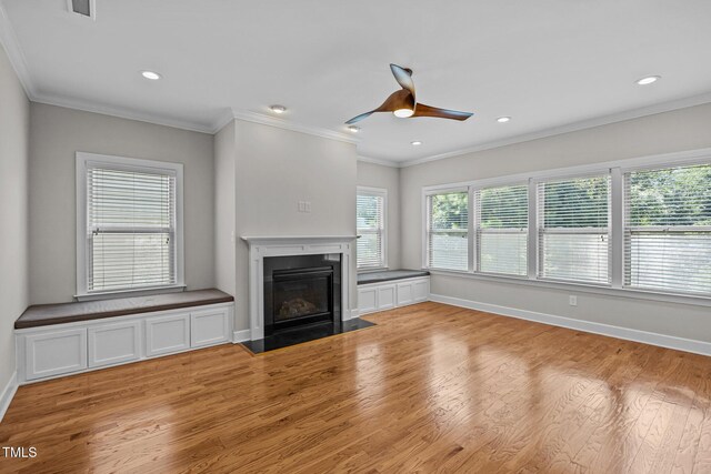 111 Court Jester Way, Morrisville, NC 27560 - unfurnished living room with ceiling fan, light wood-style floors, a fireplace with flush hearth, recessed lighting, and ornamental molding