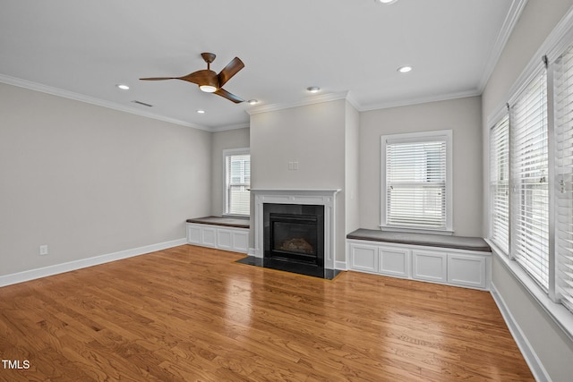 111 Court Jester Way, Morrisville, NC 27560 - unfurnished living room featuring light wood-style floors, a ceiling fan, a fireplace with flush hearth, recessed lighting, and crown molding