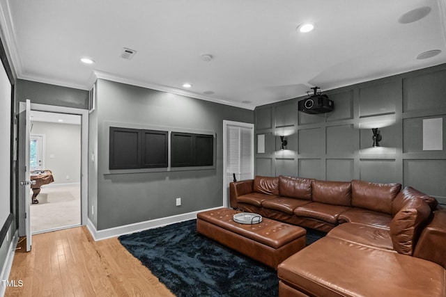 111 Court Jester Way, Morrisville, NC 27560 - living area featuring ornamental molding, a decorative wall, light wood-type flooring, and recessed lighting