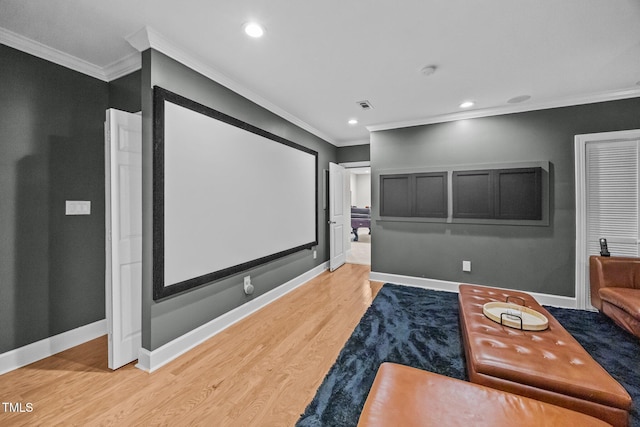 111 Court Jester Way, Morrisville, NC 27560 - cinema room featuring ornamental molding, light wood-style flooring, and recessed lighting