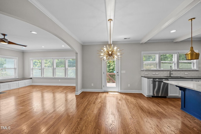 111 Court Jester Way, Morrisville, NC 27560 - kitchen with dishwasher, light wood finished floors, open floor plan, decorative backsplash, and hanging light fixtures