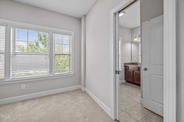 111 Court Jester Way, Morrisville, NC 27560 - empty room with baseboards and light tile patterned floors