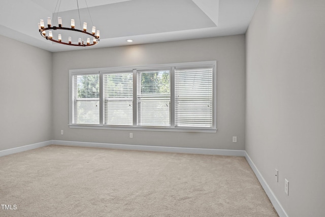111 Court Jester Way, Morrisville, NC 27560 - spare room featuring a chandelier and light carpet